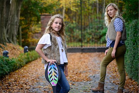 simsearch:649-08950750,k - Portrait of two sisters with long blond hair in autumn park Stock Photo - Premium Royalty-Free, Code: 649-08950738