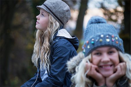 simsearch:649-08950750,k - Portrait of girl and her sister in rural landscape wearing knit hat Stock Photo - Premium Royalty-Free, Code: 649-08950747