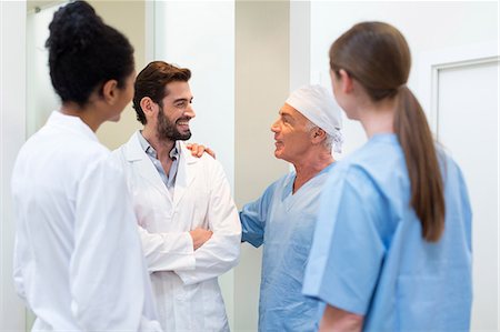 simsearch:640-03257612,k - Group of doctors talking in hospital Stock Photo - Premium Royalty-Free, Code: 649-08950930