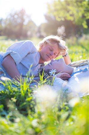simsearch:6116-08916123,k - Romantic young couple lying down together in grass, Majorca, Spain Photographie de stock - Premium Libres de Droits, Code: 649-08951026