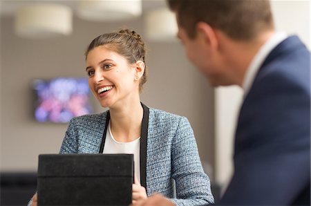 simsearch:649-08968790,k - Businesswoman meeting male colleague in boardroom Stock Photo - Premium Royalty-Free, Code: 649-08968788