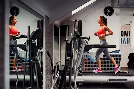 simsearch:649-08238188,k - Young woman training, running on gym treadmill Foto de stock - Sin royalties Premium, Código: 649-08969510