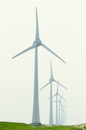 simsearch:649-09230104,k - Row of wind turbines in field dyke landscape Stock Photo - Premium Royalty-Free, Code: 649-08969538