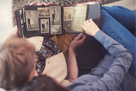 simsearch:649-03858053,k - Overhead view of young woman on sofa with grandmother looking at photo album Stock Photo - Premium Royalty-Free, Code: 649-08969530