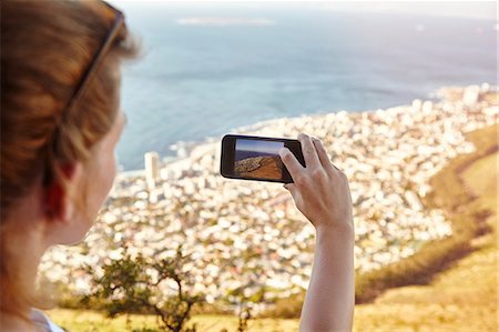 simsearch:649-08969763,k - Young woman on mountain, photographing view, Lions Head Mountain, Western Cape, Cape Town, South Africa, Africa Fotografie stock - Premium Royalty-Free, Codice: 649-08969773