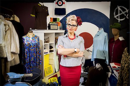 simsearch:649-08987755,k - Portrait of quirky vintage mature woman in vintage clothes shop Stock Photo - Premium Royalty-Free, Code: 649-08987760
