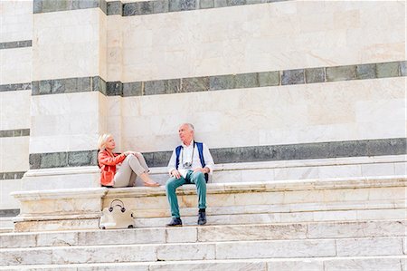 duomo di siena - Tourist couple sitting on Siena cathedral stairway, Tuscany, Italy Stock Photo - Premium Royalty-Free, Code: 649-08987826