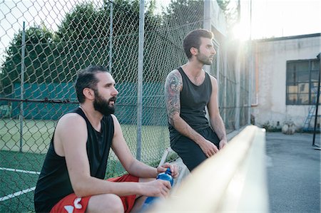 Friends sitting by sports court Stock Photo - Premium Royalty-Free, Code: 649-08988169