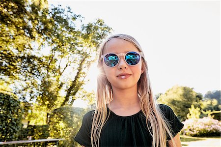 Girl in sunglasses enjoying sunny day Stock Photo - Premium Royalty-Free, Code: 649-08988362