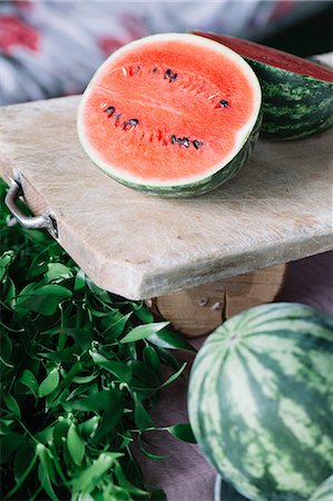 rustic organic - Halved watermelon on cutting board Stock Photo - Premium Royalty-Free, Code: 649-08988453