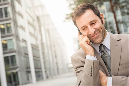 simsearch:649-06532676,k - Businessman talking on cell phone Stock Photo - Premium Royalty-Free, Code: 649-09004015