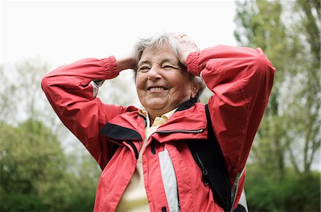 Frustrated older woman walking in park Stock Photo - Premium Royalty-Free, Code: 649-09004082