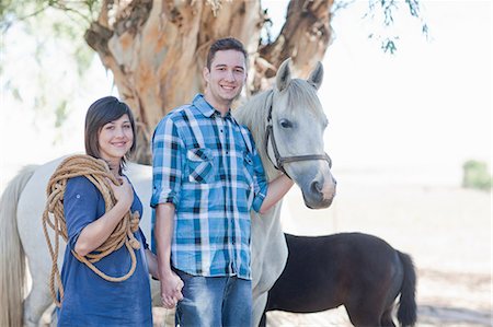 Young couple holding hands leading horse Stock Photo - Premium Royalty-Free, Code: 649-09004166