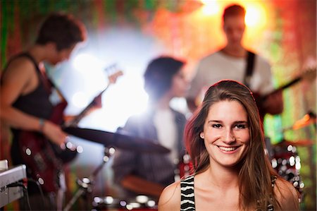 simsearch:649-06844687,k - Teenagers at concert, teenage girl in foreground Stock Photo - Premium Royalty-Free, Code: 649-09004364