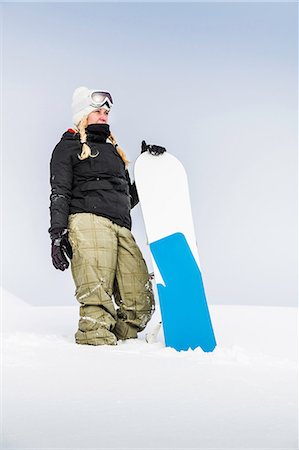 simsearch:6113-08655494,k - Portrait of young female with snowboard, Reutte, Tyrol, Austria Stock Photo - Premium Royalty-Free, Code: 649-09004539