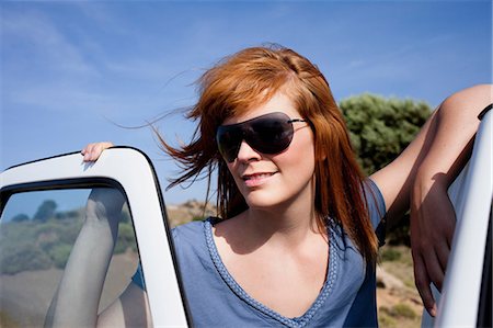 simsearch:649-07437936,k - Woman leaning on car Stock Photo - Premium Royalty-Free, Code: 649-09002313