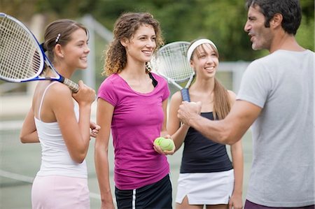 preteen tennis - Tennis coach talking to students Stock Photo - Premium Royalty-Free, Code: 649-09002604