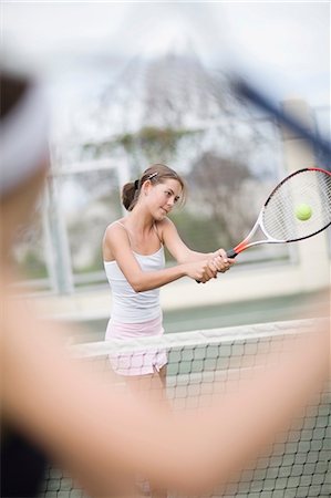 Serious girl playing tennis Stock Photo - Premium Royalty-Free, Code: 649-09002605