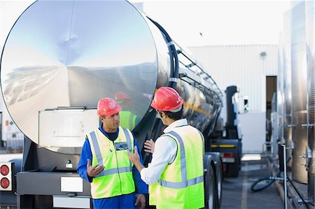 simsearch:6122-08229062,k - Workers talking by tanker truck Stock Photo - Premium Royalty-Free, Code: 649-09002650