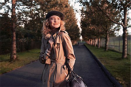 Woman walking on rural road Stock Photo - Premium Royalty-Free, Code: 649-09002701