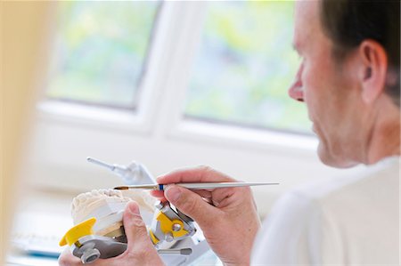 dental technician - Dentist working on set of teeth Stock Photo - Premium Royalty-Free, Code: 649-09003462