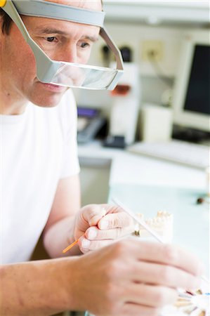 dental technician - Close up of scientist working in lab Stock Photo - Premium Royalty-Free, Code: 649-09003471