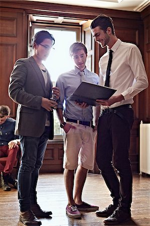 simsearch:630-06724589,k - Businessmen talking in ornate room Stock Photo - Premium Royalty-Free, Code: 649-09003727