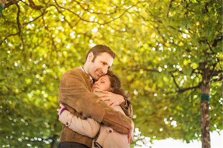 simsearch:649-06532695,k - Couple hugging in park Stock Photo - Premium Royalty-Free, Code: 649-09003992
