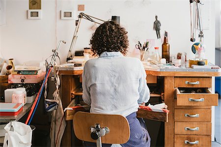 simsearch:649-09269171,k - Rear view of female jeweller working at workbench Stock Photo - Premium Royalty-Free, Code: 649-09016526