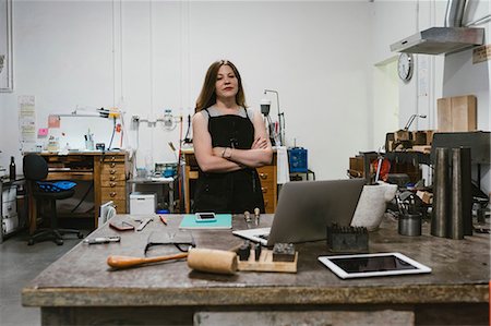 simsearch:649-08987855,k - Portrait of female jeweller with arms folded in jewellery workshop Photographie de stock - Premium Libres de Droits, Code: 649-09016594