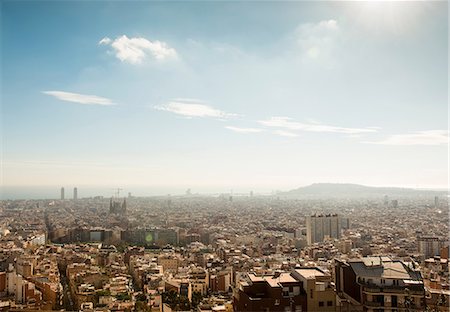 Elevated cityscape view with La Sagrada Familia and distant coast, Barcelona, Spain Stock Photo - Premium Royalty-Free, Code: 649-09016932