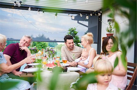 simsearch:649-09025497,k - Three generation family having lunch on patio Photographie de stock - Premium Libres de Droits, Code: 649-09025520
