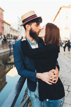 simsearch:649-08923913,k - Hipster couple kissing by city canal Stock Photo - Premium Royalty-Free, Code: 649-09025559