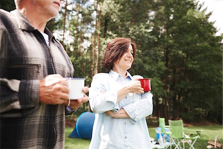 simsearch:649-08381585,k - Mature couple standing beside tent, holding cups of tea Stock Photo - Premium Royalty-Free, Code: 649-09025679