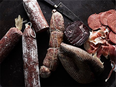 Selection of cured meats, overhead view Stock Photo - Premium Royalty-Free, Code: 649-09025718