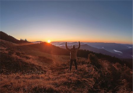 simsearch:649-09026161,k - Man greeting sunrise, Odessa, Odessa Oblast, Ukraine Photographie de stock - Premium Libres de Droits, Code: 649-09026156