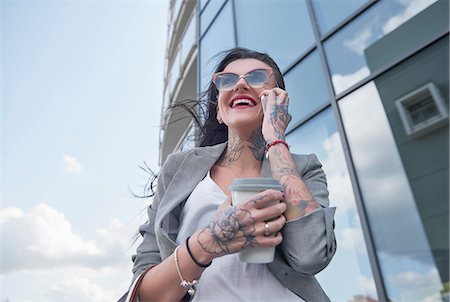 Tattooed business woman Stock Photos - Page 1 : Masterfile