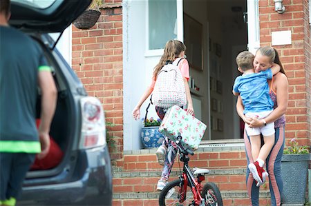 female in boots - Family unpacking car after holiday Stock Photo - Premium Royalty-Free, Code: 649-09035594