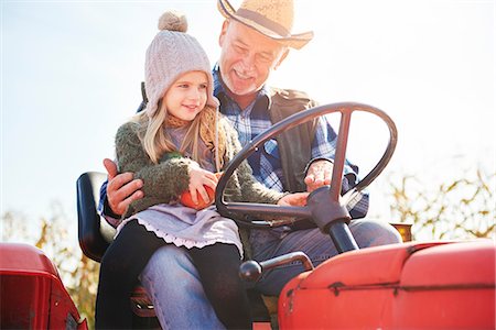 Farmer and granddaughter at pumpkin farm Stock Photo - Premium Royalty-Free, Code: 649-09035945