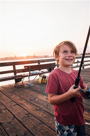 simsearch:649-09035962,k - Boy on pier with fishing rod smiling, Goleta, California, United States, North America Stockbilder - Premium RF Lizenzfrei, Bildnummer: 649-09035964