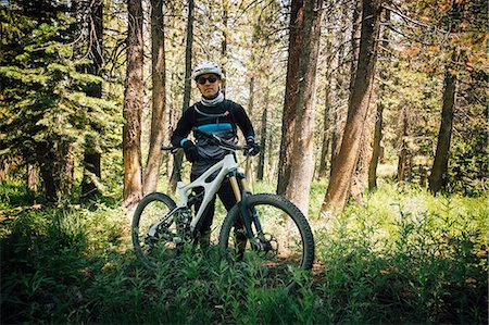 simsearch:649-08232809,k - Man in forest with mountain bike, looking at camera, Mammoth Lake, California, USA, North America Stock Photo - Premium Royalty-Free, Code: 649-09035972