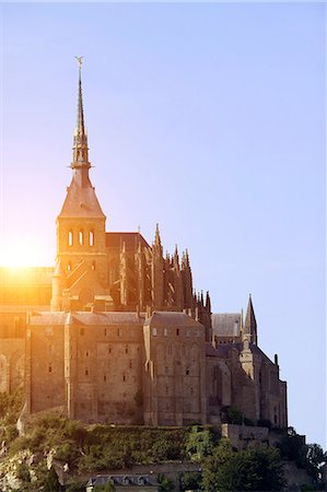simsearch:649-08923905,k - Sunlit view of Mont Saint-Michel against blue sky, Normandy, France Stock Photo - Premium Royalty-Free, Code: 649-09036363