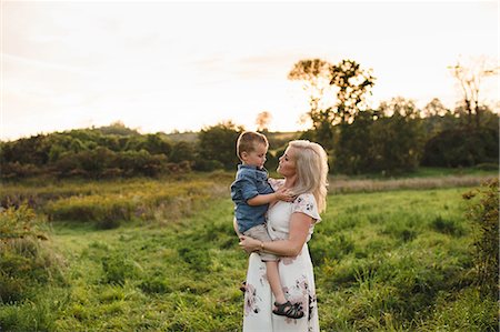 Mother holding son in rural area Stock Photo - Premium Royalty-Free, Code: 649-09061309