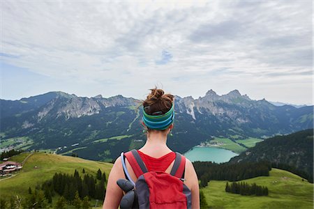 Rear view of female hiker looking out over valley in Tannheim mountains, Tyrol, Austria Stock Photo - Premium Royalty-Free, Code: 649-09061703