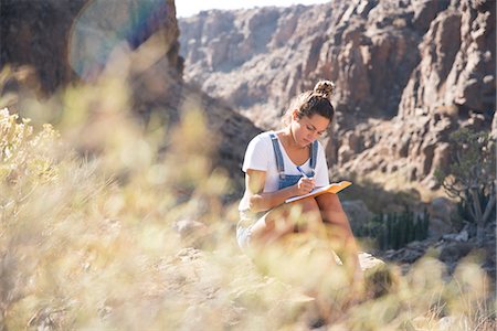 simsearch:649-09148718,k - Young female hiker writing notes in valley, Las Palmas, Canary Islands, Spain Foto de stock - Sin royalties Premium, Código: 649-09061923