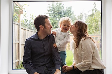 simsearch:649-08548833,k - Parents and baby boy playing by patio door to garden Stock Photo - Premium Royalty-Free, Code: 649-09078037