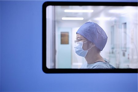 simsearch:649-09078375,k - Window view of two female surgeon in maternity ward operating theatre Stock Photo - Premium Royalty-Free, Code: 649-09078374