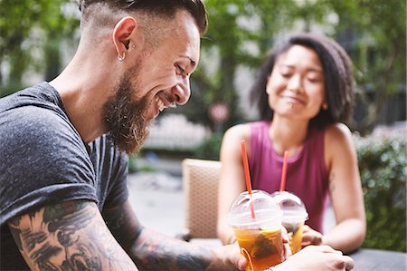 simsearch:614-08270079,k - Multi ethnic hipster couple at sidewalk cafe, Shanghai French Concession, Shanghai, China Stock Photo - Premium Royalty-Free, Code: 649-09078428