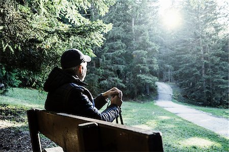 Hiker sitting on bench looking away at view, Madonna di Pietralba, Trentino-Alto Adige, Italy, Europe Fotografie stock - Premium Royalty-Free, Codice: 649-09078504