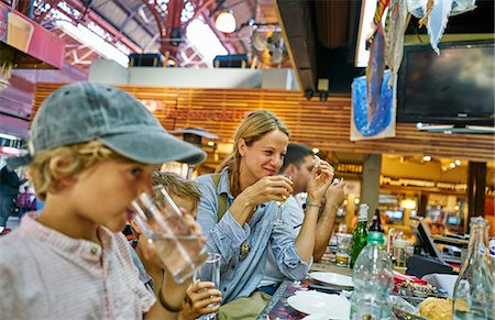 ethnic family at restaurant - Family having lunch together in restaurant, Montevideo, Uruguay, South America Stock Photo - Premium Royalty-Free, Code: 649-09078591